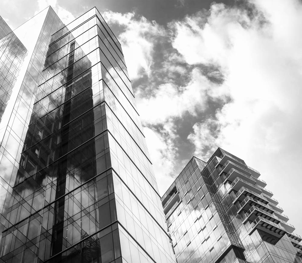 Modern Glass and Steel Buildings Reflecting the Sky